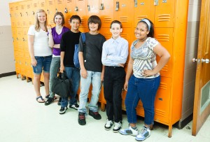 High school students by lockers represents inclusivity training for trans students in schools